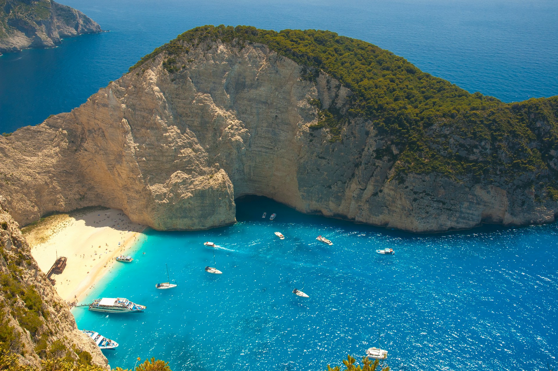 Navagio Beach — Shipwreck Beach with turquoise water surrounded by white cliffs